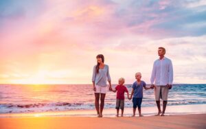 Family walking on beach