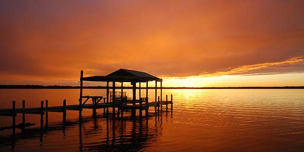 Northeast Florida featured neighborhoods — Dock at sunset on the St. Johns River