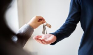 Jacksonville Realtor handing keys to new home owner