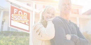Jacksonville couple in front of sold home