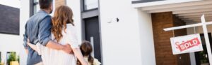 Jacksonville family looking at their sold house by Red Door Realty Group